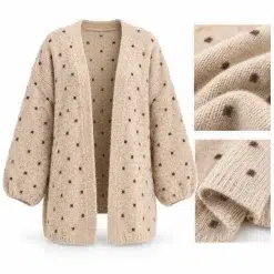 Close-up of beige wool cardigan with small brown polka dot details